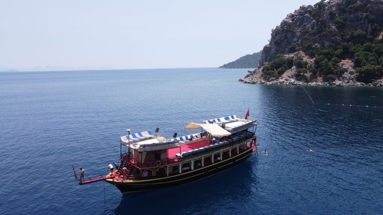 Marmaris gulet tour cruising along the pine-covered Aegean coastline