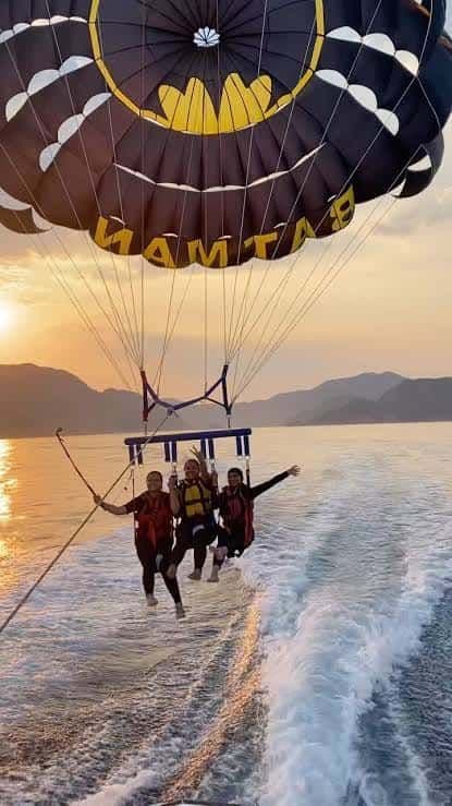 Parasailing in Marmaris at sunset over the Aegean Sea